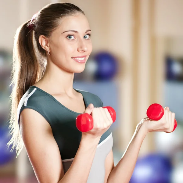 Beautiful sport woman doing exercise with dumbbell — Stock Photo, Image