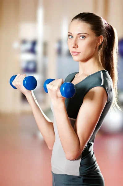 Beautiful sport woman doing exercise with dumbbell — Stock Photo, Image