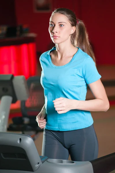 Gym exercising. Run on on a machine. — Stock Photo, Image
