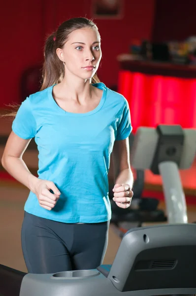 Gym exercising. Run on on a machine. — Stock Photo, Image