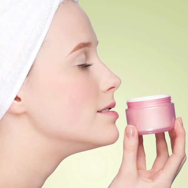 Beautiful woman tender jar of moisturizer cream — Stock Photo, Image