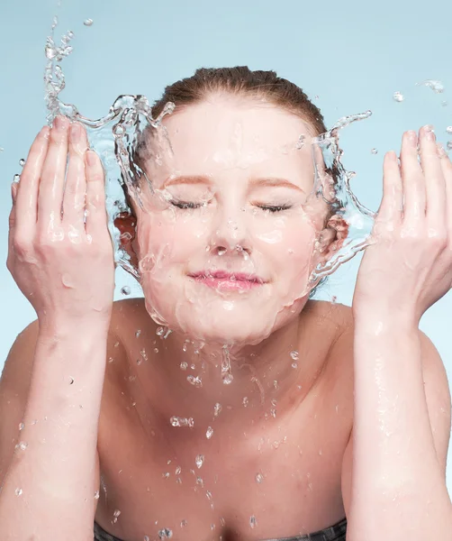 stock image Portrait of beautiful emotional woman washing face