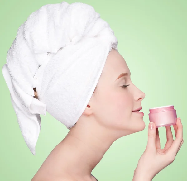 Beautiful woman smell jar of moisturizer cream — Stock Photo, Image