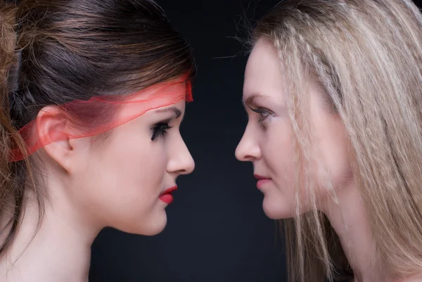 stock image Closeup portrait of two girls: good & evil