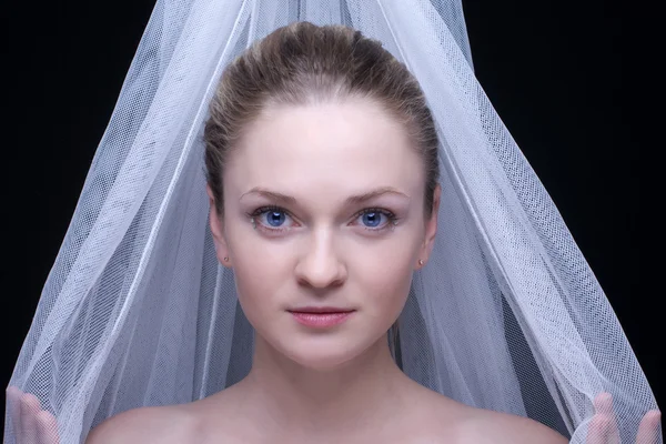 Stock image Closeup portrait of beautiful blond girl in white fabric