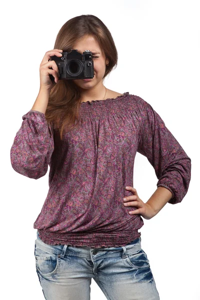 Jeune fille brune avec une caméra — Photo
