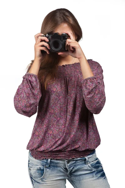 Jeune fille brune avec une caméra — Photo