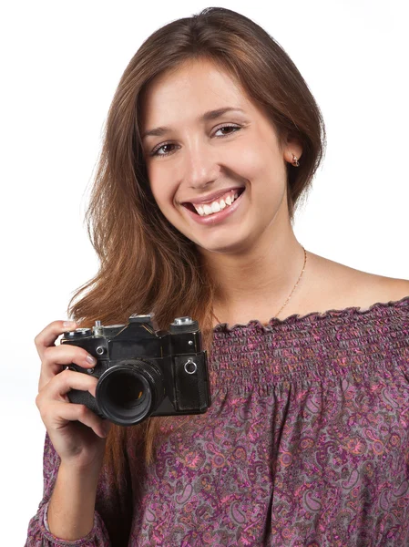 Young brunette girl with a camera — Stock Photo, Image