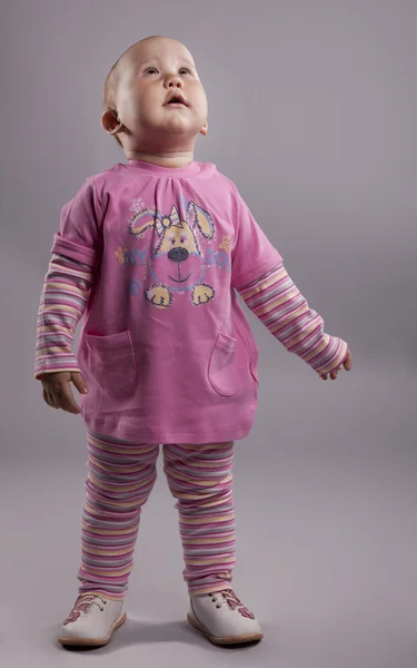 O bebê em um vestido rosa — Fotografia de Stock