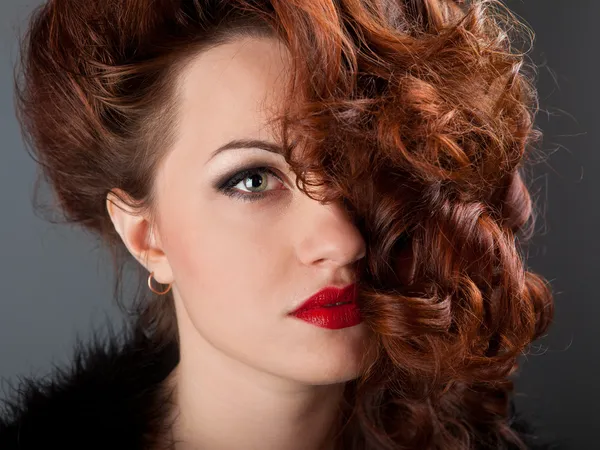 Portrait of a curly red-haired girl with red lips — Stock Photo, Image