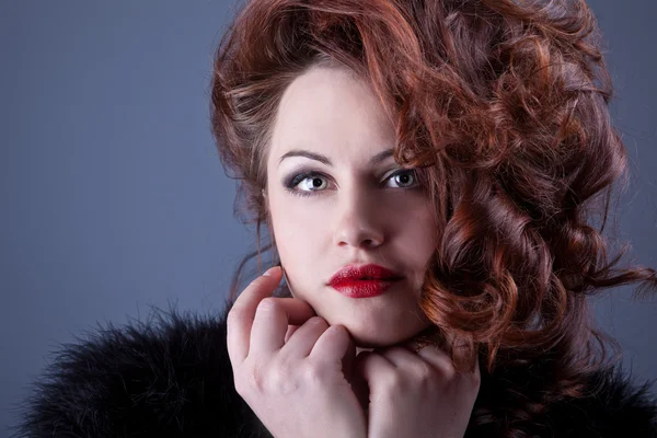 Portrait of a curly red-haired girl with red lips — Stock Photo, Image