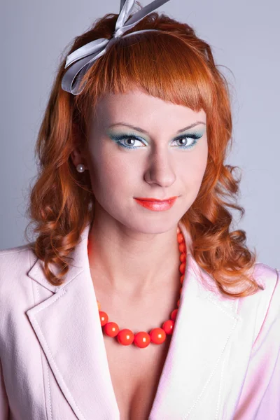 Portrait of a red-haired girl in a white suit — Stock Photo, Image