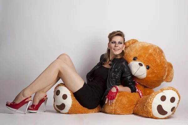 Girl with a big teddy bear — Stock Photo, Image