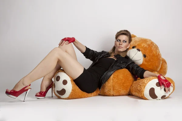 Girl with a big teddy bear — Stock Photo, Image