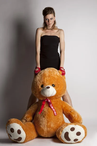 Girl with a big teddy bear