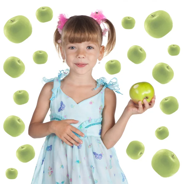 Portrait of a cute little girl in a blue dress with a fresh gree — Stock Photo, Image