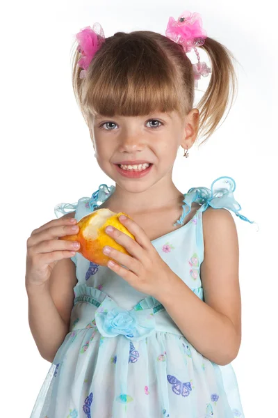 Pretty little girl with a juicy pear — Stock Photo, Image