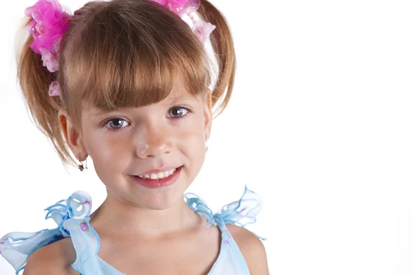Portrait of a cute little girl in blue dress — Stock Photo, Image