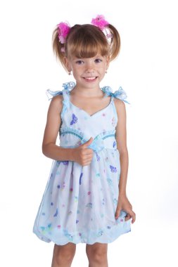Portrait of a cute little girl in blue dress clipart