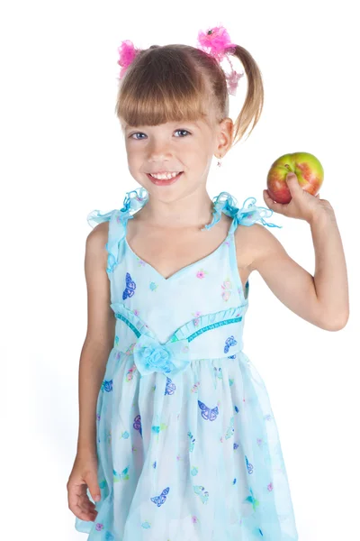 Bella ragazza in un abito blu con una mela in mano — Foto Stock