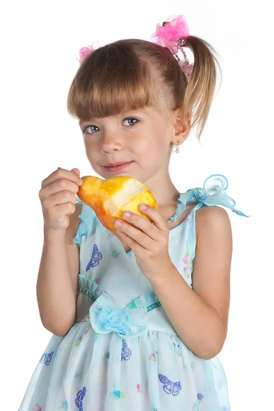 Pretty little girl with a juicy pear — Stock Photo, Image