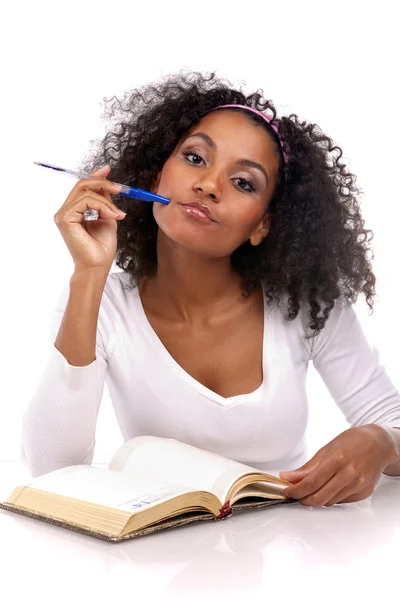 A beautiful dark-skinned woman with a note-book in a white dress — Stock Photo, Image