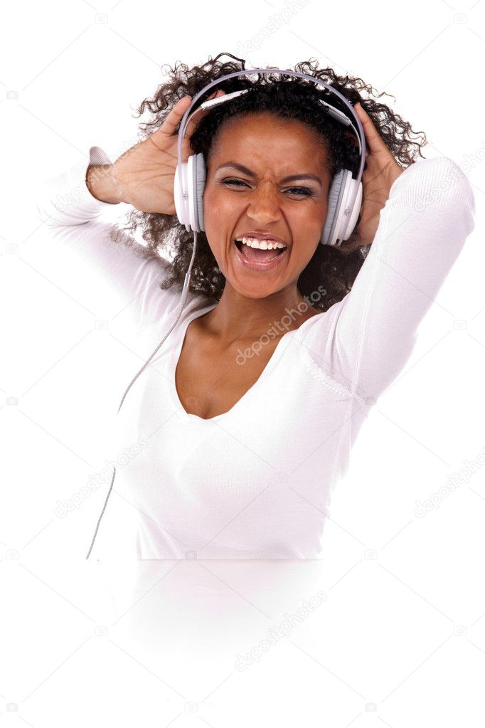 Portrait of a beautiful black woman with headphones listening to