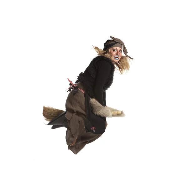 stock image Young woman witch fly on broom