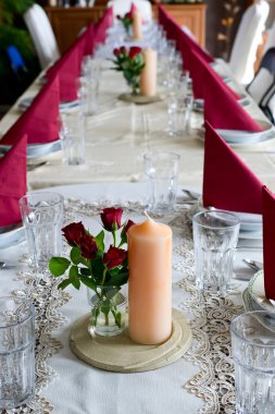 Banquet table setting themed with roses clipart