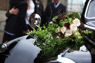 Bridal bouquet on vintage wedding car clipart