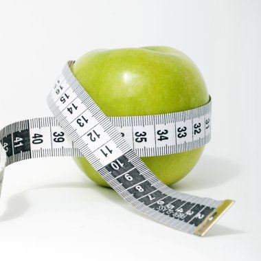 Fresh green apple with measuring tape clipart