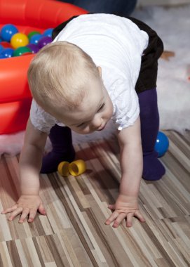 Baby taking first steps clipart