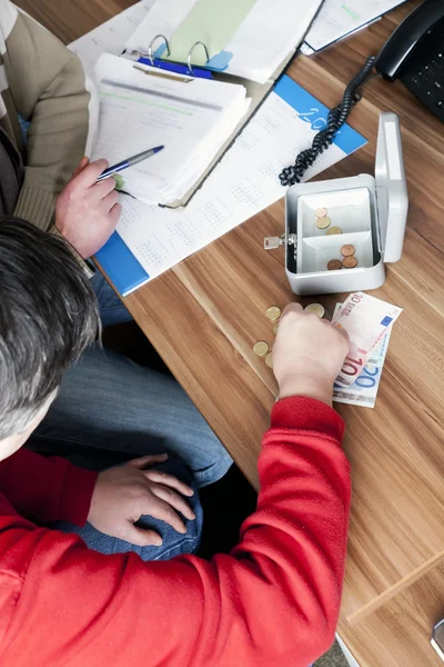 stock image Counting money in cash box