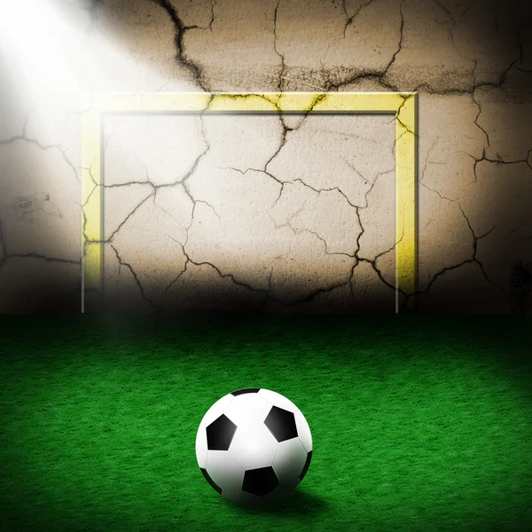 Мяч для футбола напротив каменной стены — стоковое фото