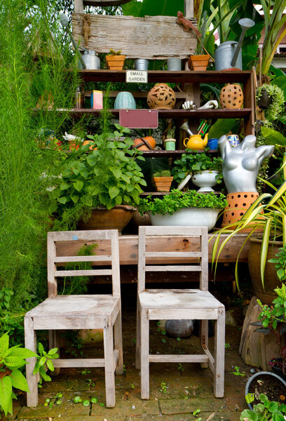 Small garden with wooden chairs