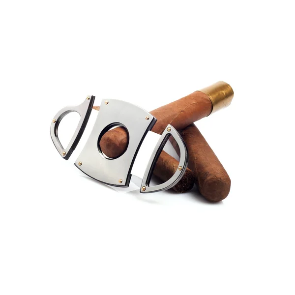 Cigars and a cutter that cut one of it isolated on white backgro — Stock Photo, Image