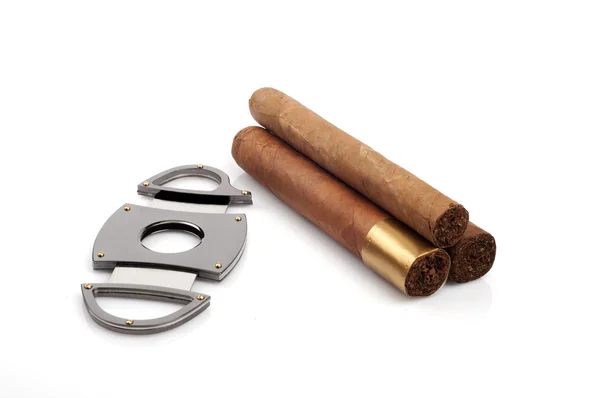 Cigars and a open cutter isolated on white background — Stock Photo, Image