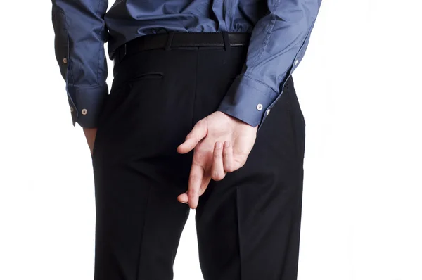 Man hold and hide on his back his cross fingers — Stock Photo, Image
