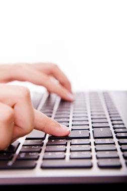 Close-up of secretary hand touching computer ENTER key during wo clipart