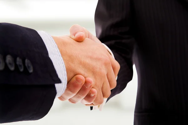 stock image Closeup of business shaking hands at the office