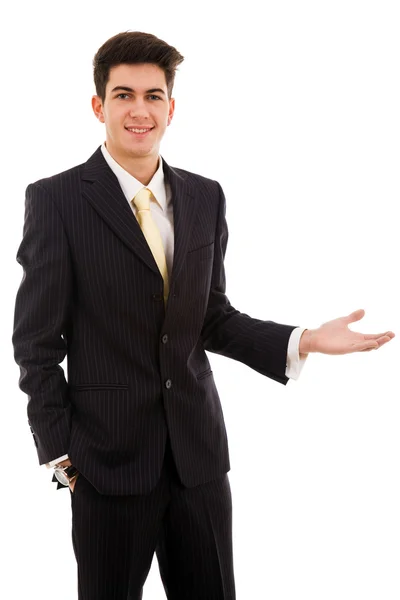 Glücklicher junger Geschäftsmann präsentiert vor weißem Hintergrund — Stockfoto