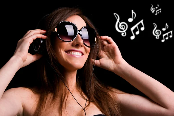 Portrait of happy girl listening music in headphones. Studio sho — Stock Photo, Image