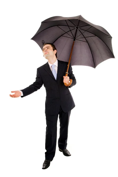 A businessman holding an umbrella and checking if it rains. Isol — Stock Photo, Image