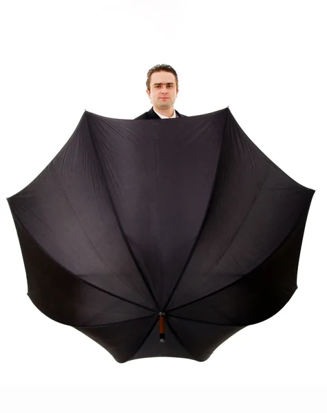 Jovem empresário segurando um guarda-chuva no fundo branco — Fotografia de Stock