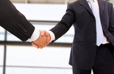 Handshake isolated on business environment. clipart
