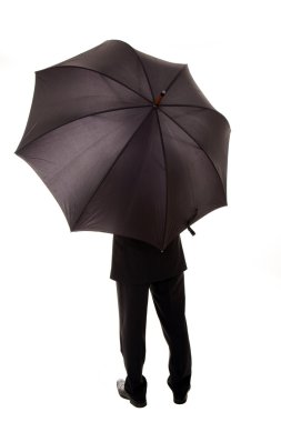 Business man hold an umbrella standing back, isolated over white clipart