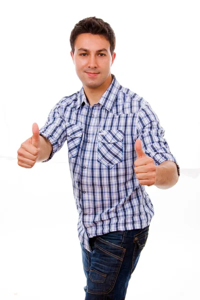 Jovem casual homem polegares para cima, em um fundo branco — Fotografia de Stock