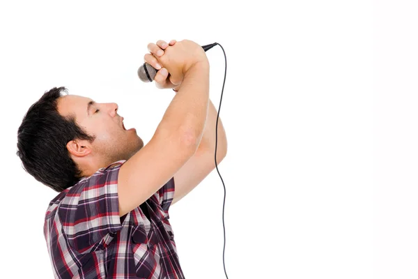 Image of a handsome young man singing to the microphone, isolate — Stock Photo, Image