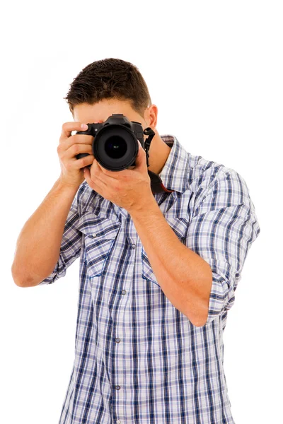 Joven fotógrafo con cámara, aislado en blanco — Foto de Stock