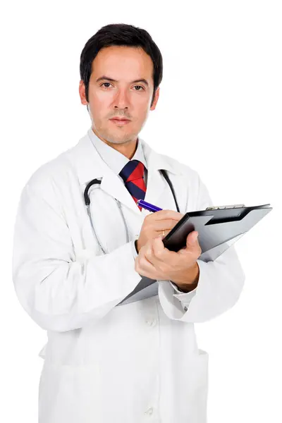 Портрет врача, записывающего заметки в блокнот: — стоковое фото